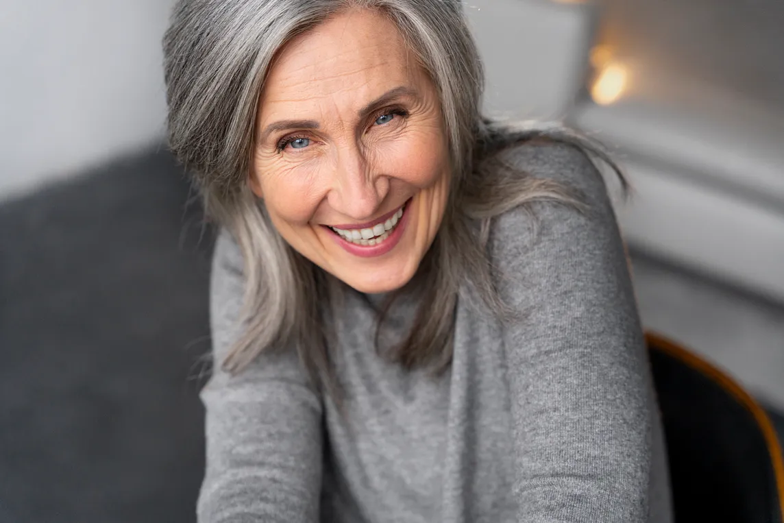 Happy gray-haired woman smiling