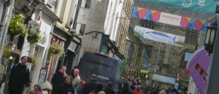 Slanted picture taken by accident of Church Street, Falmouth. King Charles the Martyr Church in the distance, Planted Cafe to the left, The Poly sort of almost visible to the right. And an Amazon Prime delivery van bang in the middle of it all.