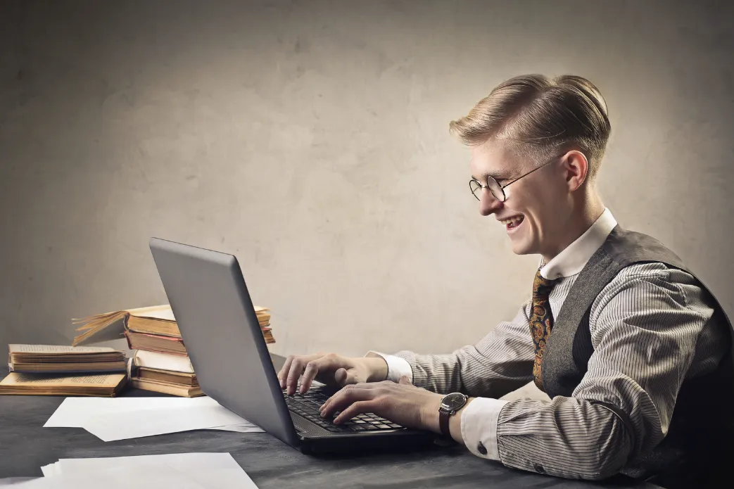 Young blonde man working very focused