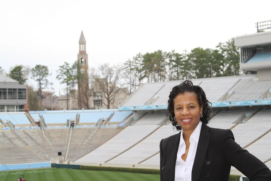 Dr. Stroman stands near the UNC Football Stadium on campus.