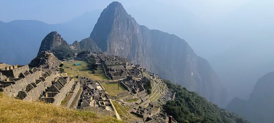 a landscape photo of the Inka ruins at Machu Picchu