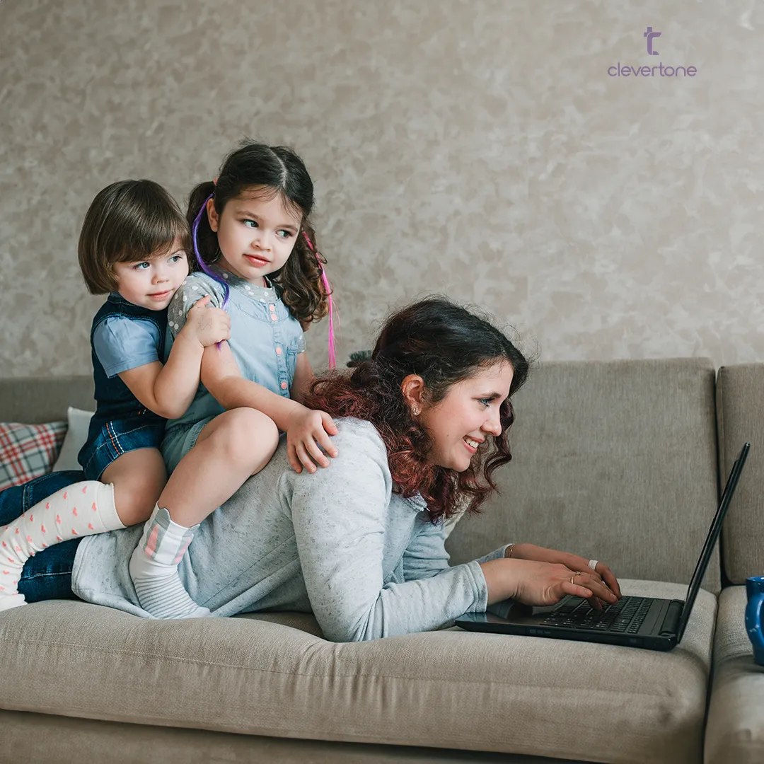 Single mom balancing work and motherhood, enjoying quality time with her kids while working from home