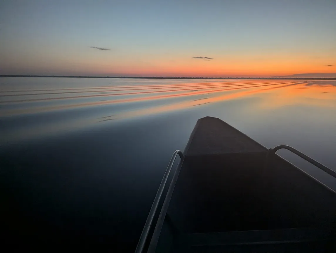 Sunrise over the Rio Negro near Tumbira, Brazil in the Amazon river basin (photo by Dave Thau)