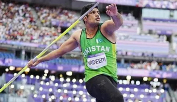 Arshad Nadeem prepares to launch the javelin at the 2024 Olympics in Paris.