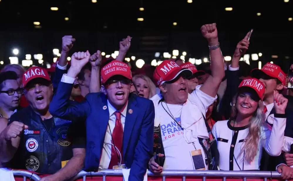 A group of cheering Trump supporters.