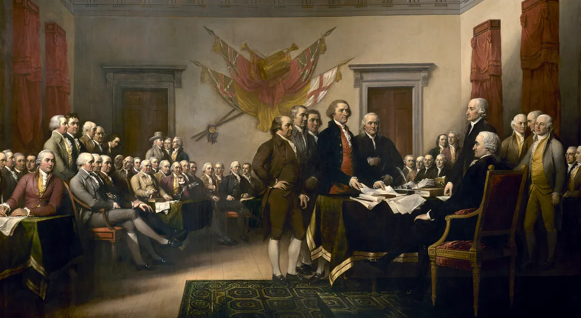 Painting called “Declaration of Independence” of an 18th century scene. Five white men stand in a fancy hall to present a seated man with a paper. Two rows of mostly seated men look on.