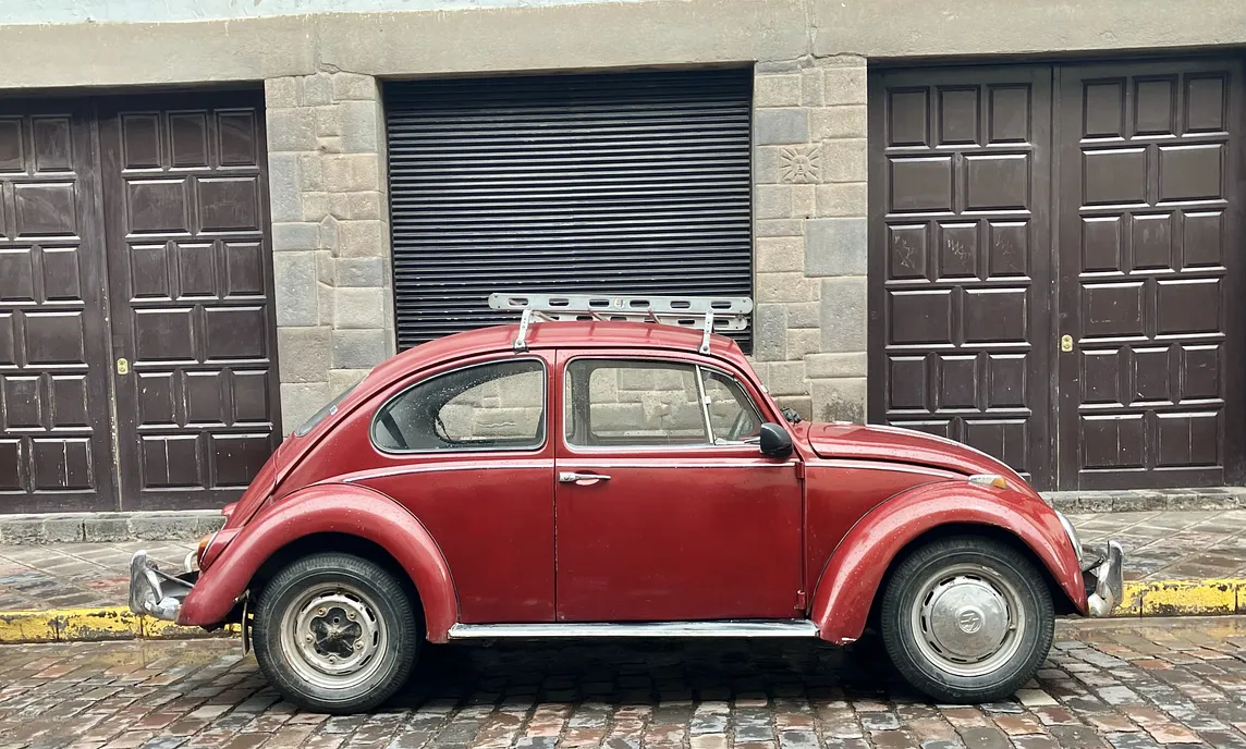 VW Beetle parked on a city street.