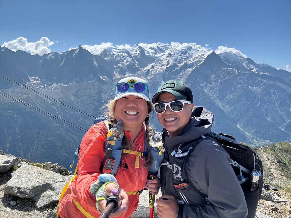 Woman and man at Le Brevent with the Mont Blanc massif in the background