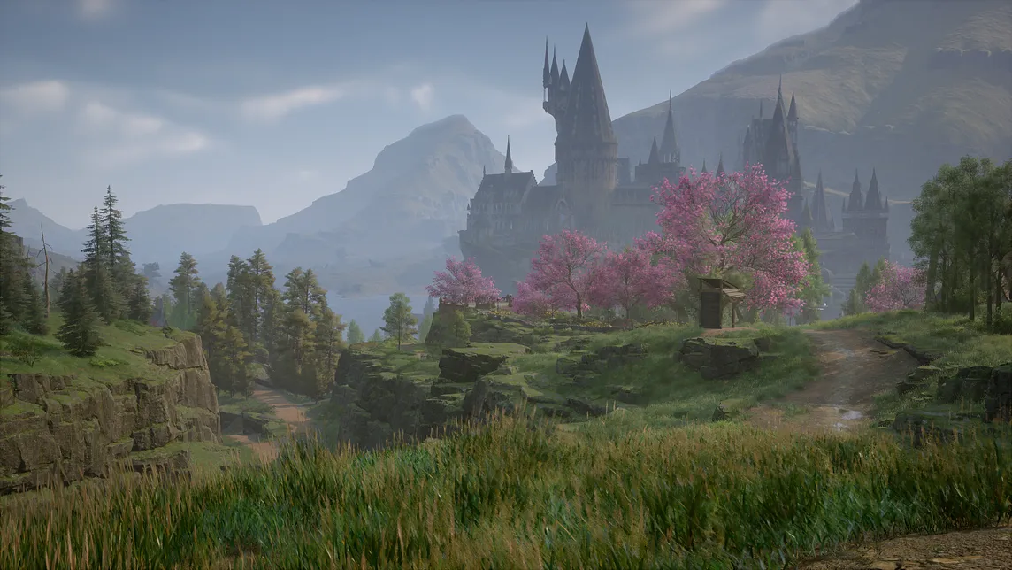 Hogwarts Castle lies in the distance beyond some rolling green fields and pink trees.