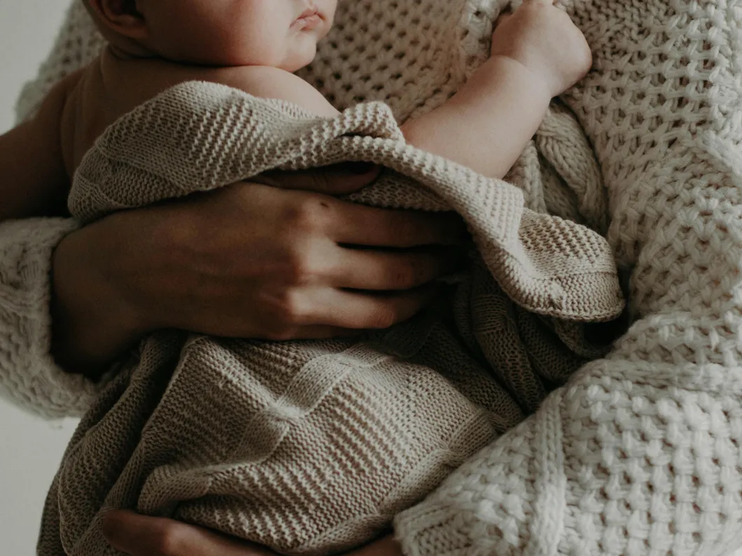 woman holding baby