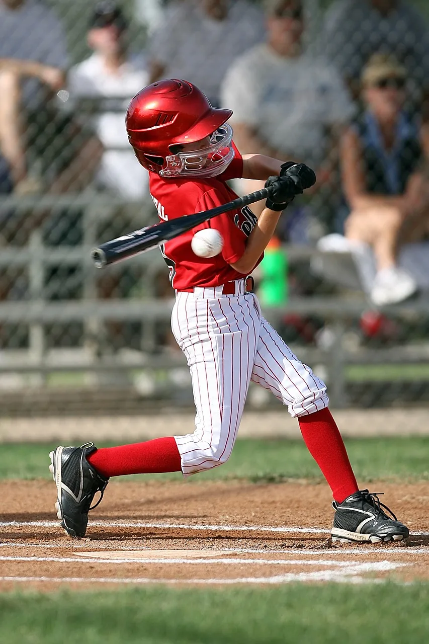 Baseball player swinging at ball