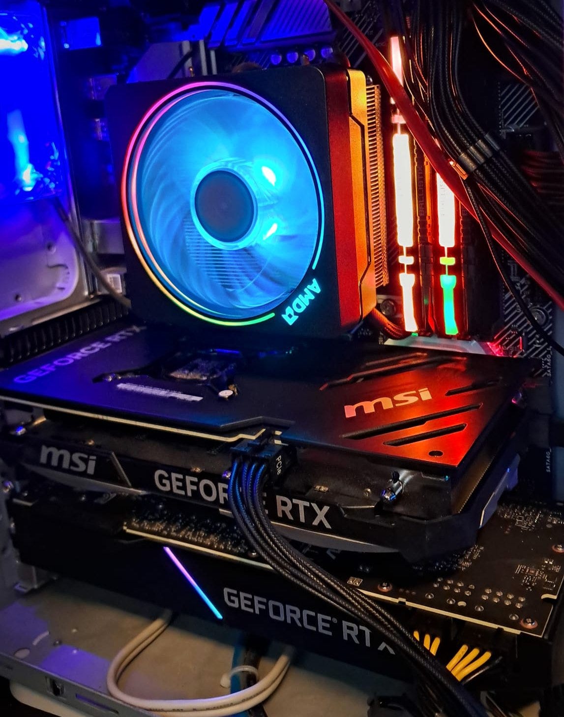 The €990 machine: an RTX 4070 and an RTX 2070 SUPER sharing a case nobody would mistake for a workstation
