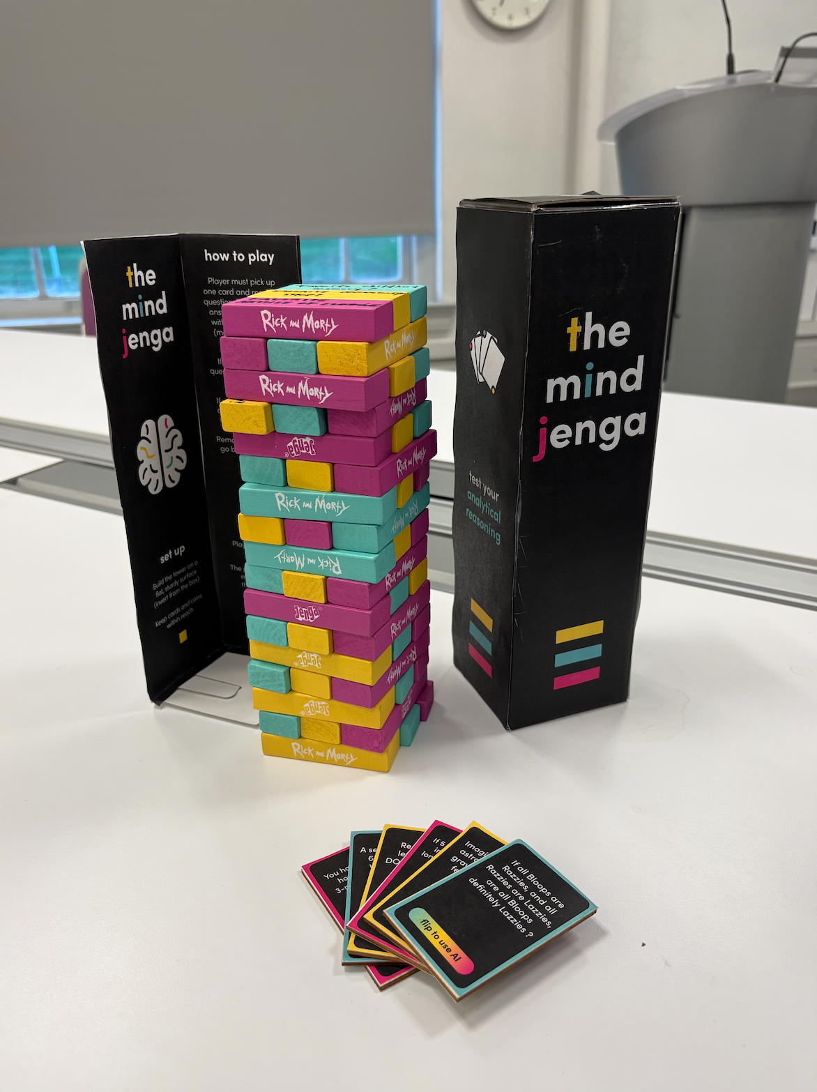 Colour coordinated Jenga blocks and question cards, outer packaging and sleeve labelled “The Mind” with the rules.