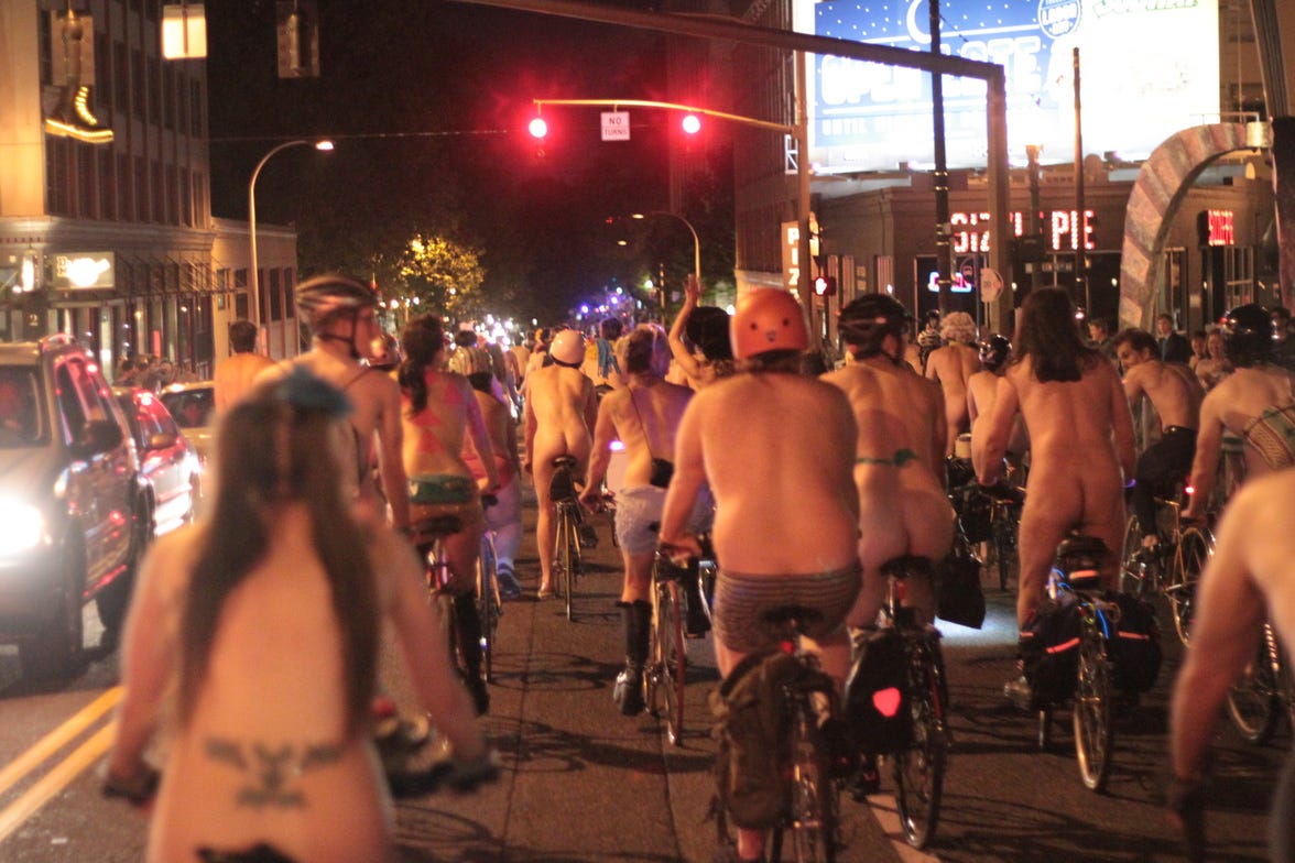 The naked bike ride heads east in Burnside from Powells