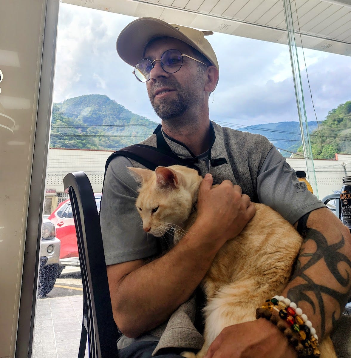 The Author, distracted by an adorable ginger along Taiwan’s cross-island highway — all photos by author