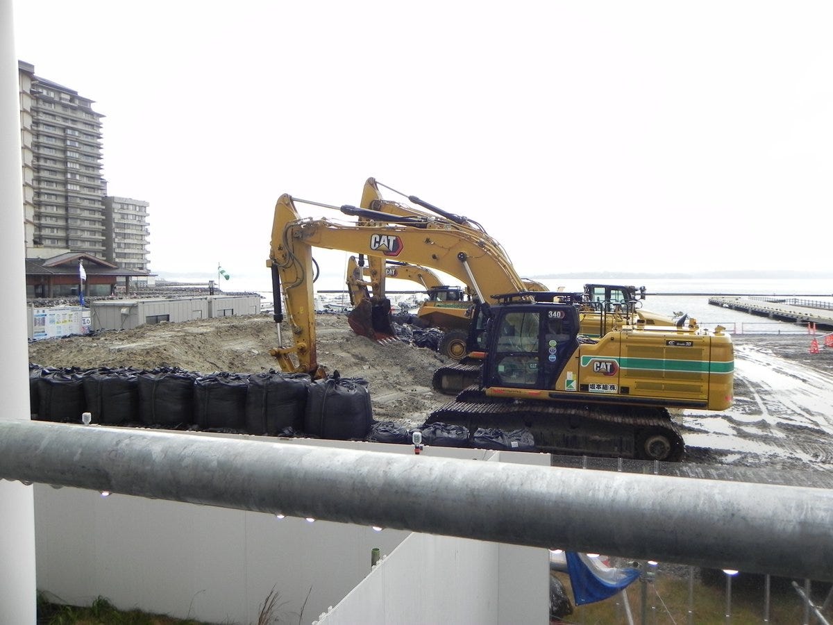 A sea wall reconstruction site. Heavy machinery was operating over a wide area.