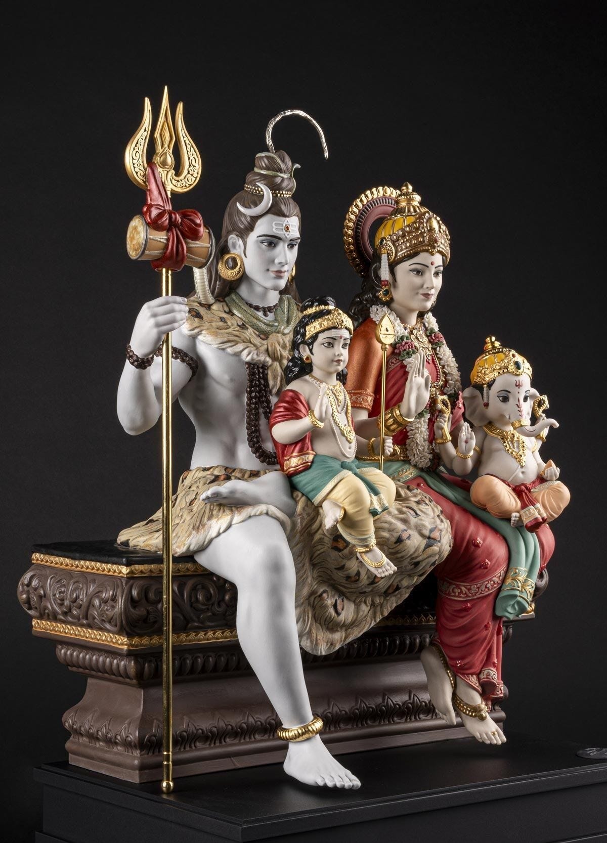 Lladró’s rendition of Shiv Parivar in a limited series of 299 units globally translates the divine family unit in handmade porcelain form. The finishes combine matt surfaces with touches of glazed ornamentations, metallic effects, gold lustres, and pearlescent reflections that add visual depth. Each deity is given their favoured weapon (trident, spear, and ankh) except for Parvati who is given a garland of 290 handmade flowers, made petal by petal. Reserve your unit with us.