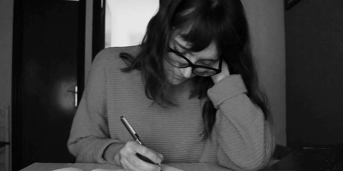 The author capturing her thoughts on paper. Photo taken by Diana Dolea