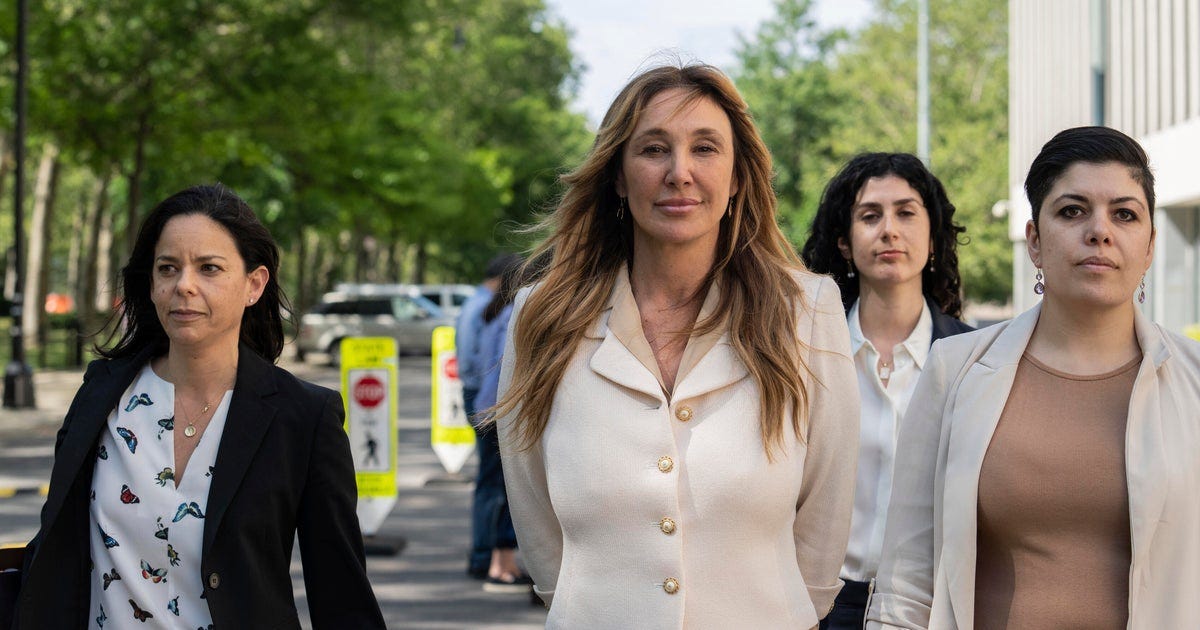 Nicole Daedone, center, founder and former CEO of OneTaste, departs Brooklyn federal court on Tuesday, June 13, 2023, in New York.Jeenah Moon / AP