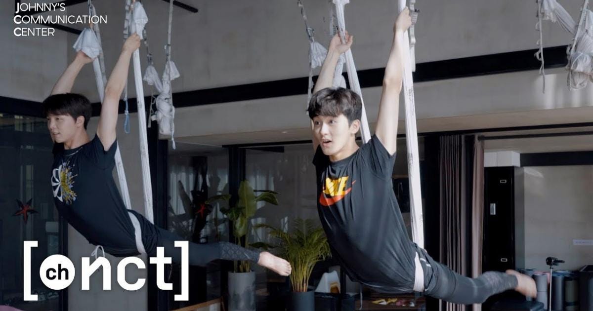 K-pop stars Johnny and Mark of NCT 127 defy gravity in aerial yoga