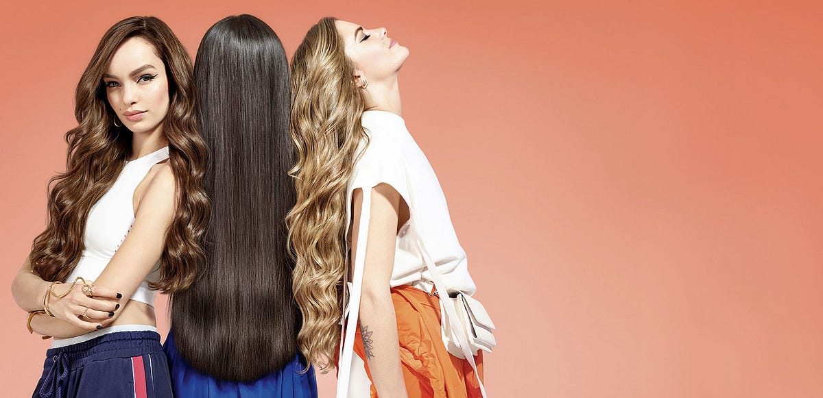 Woman styling her hair at home, achieving a salon-quality haircut glow-up