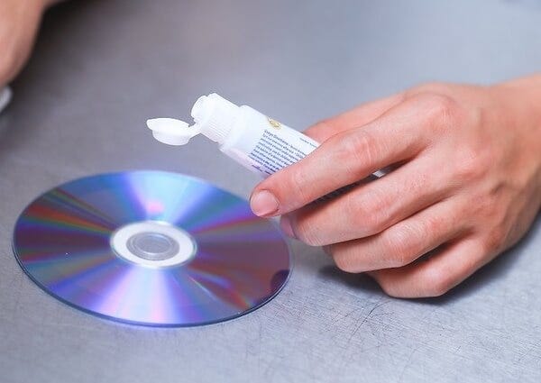 Fix a Scratched CD or DVD with Peanut Butter  How to clean dvds, Fix  scratched dvds, Scratch repair