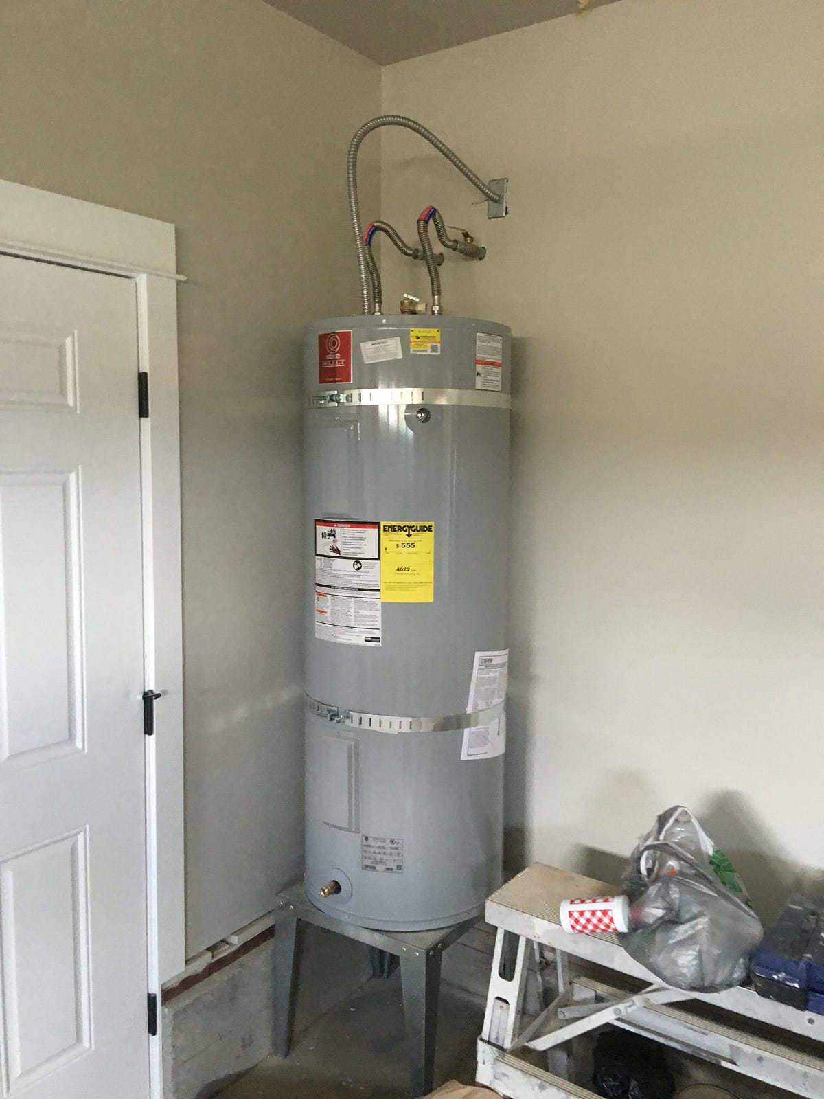 How do I replace a water heater gas valve pilot tube without draining