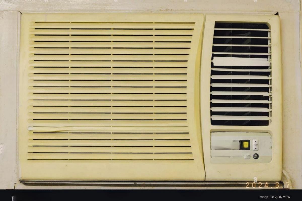 AIRCON In a four cornered room Walls and glass windows molds Sitting at