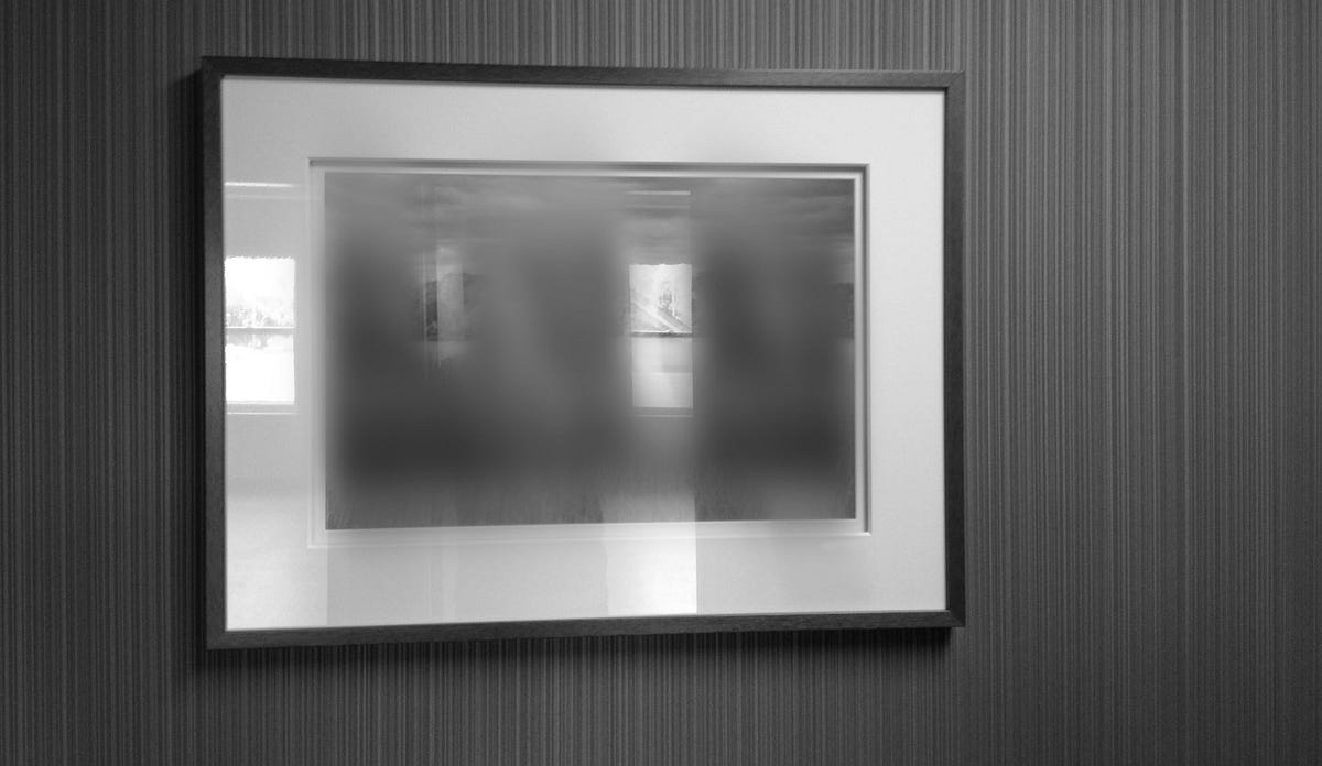 How to Take a Picture of a Glossy Photo Without Glare? by David