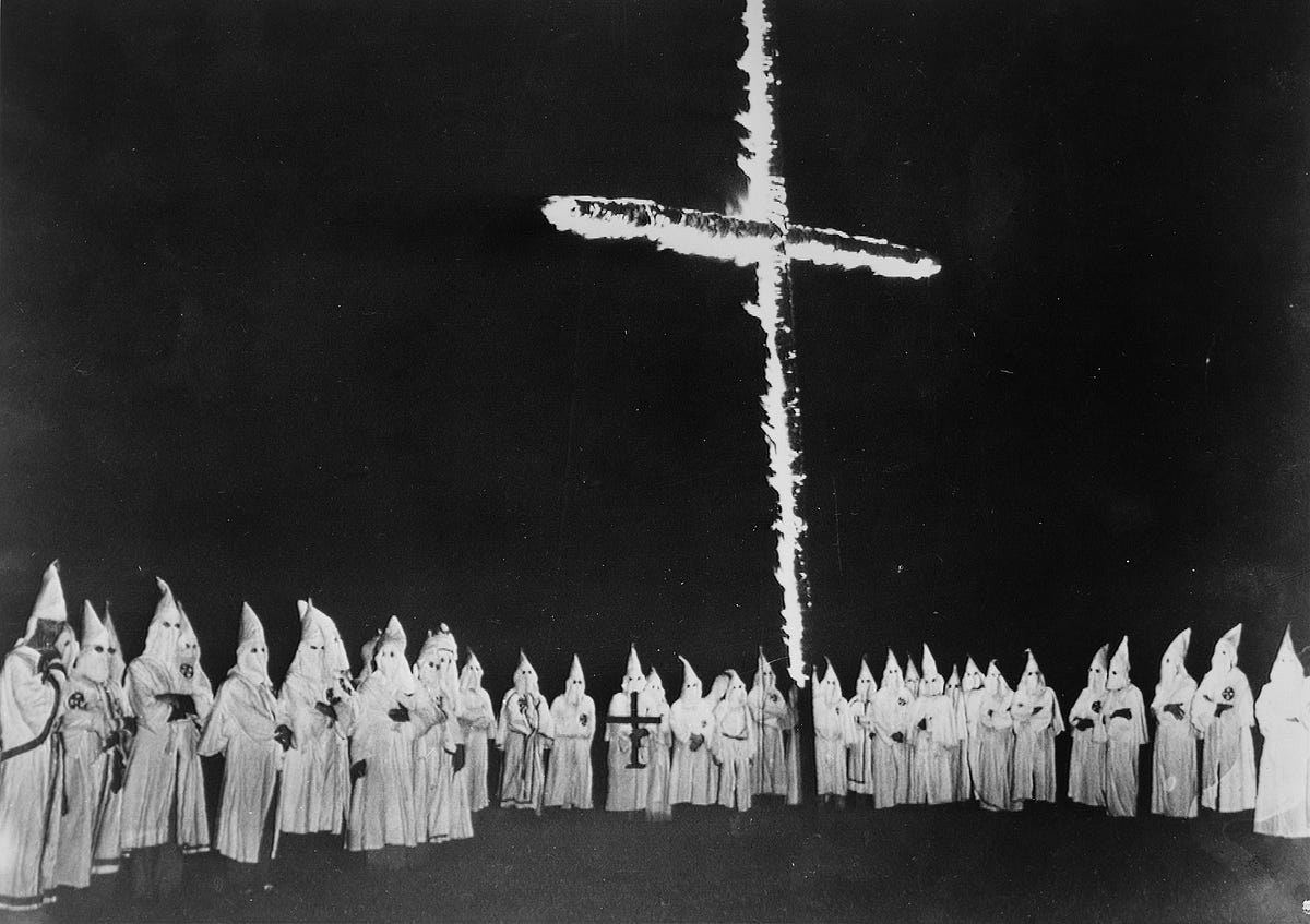 Why does the Ku Klux Klan burn crosses? They got the idea from a movie