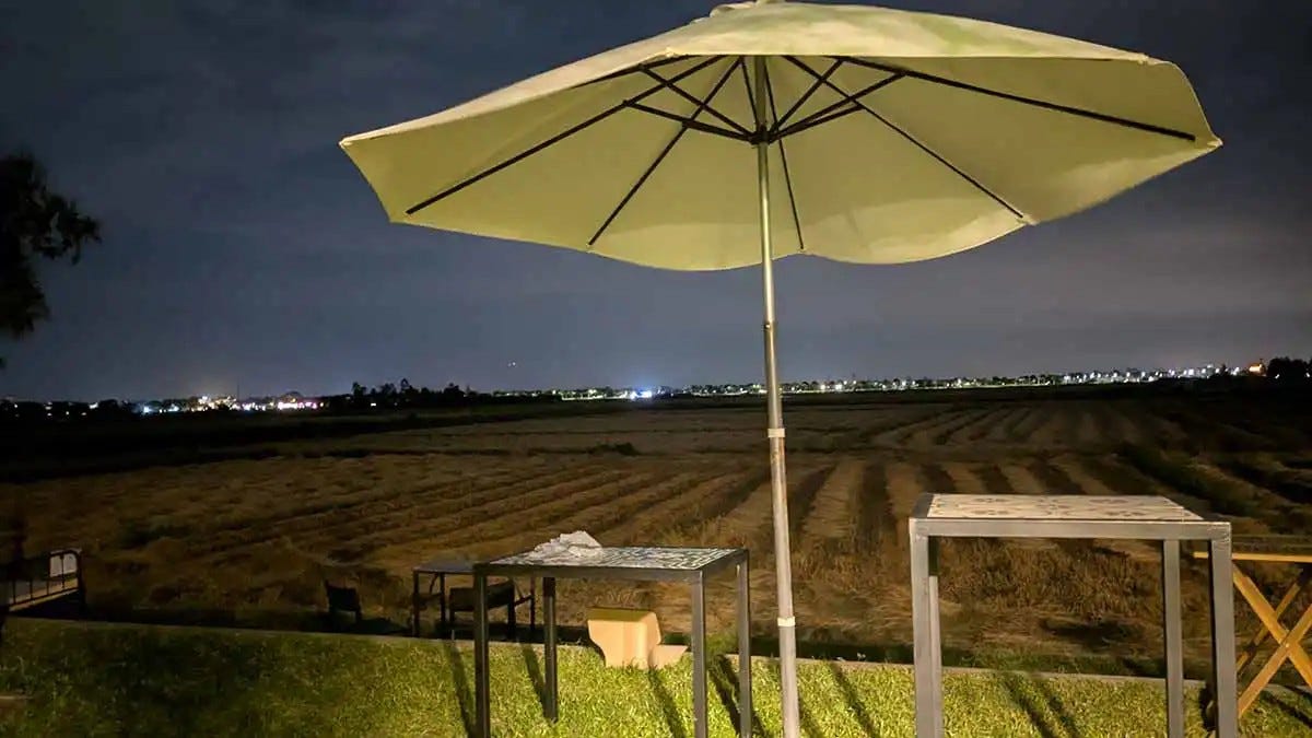 The view from the coworking space, surrounded by rice fields in Hoi An at night. Photo credit: Author