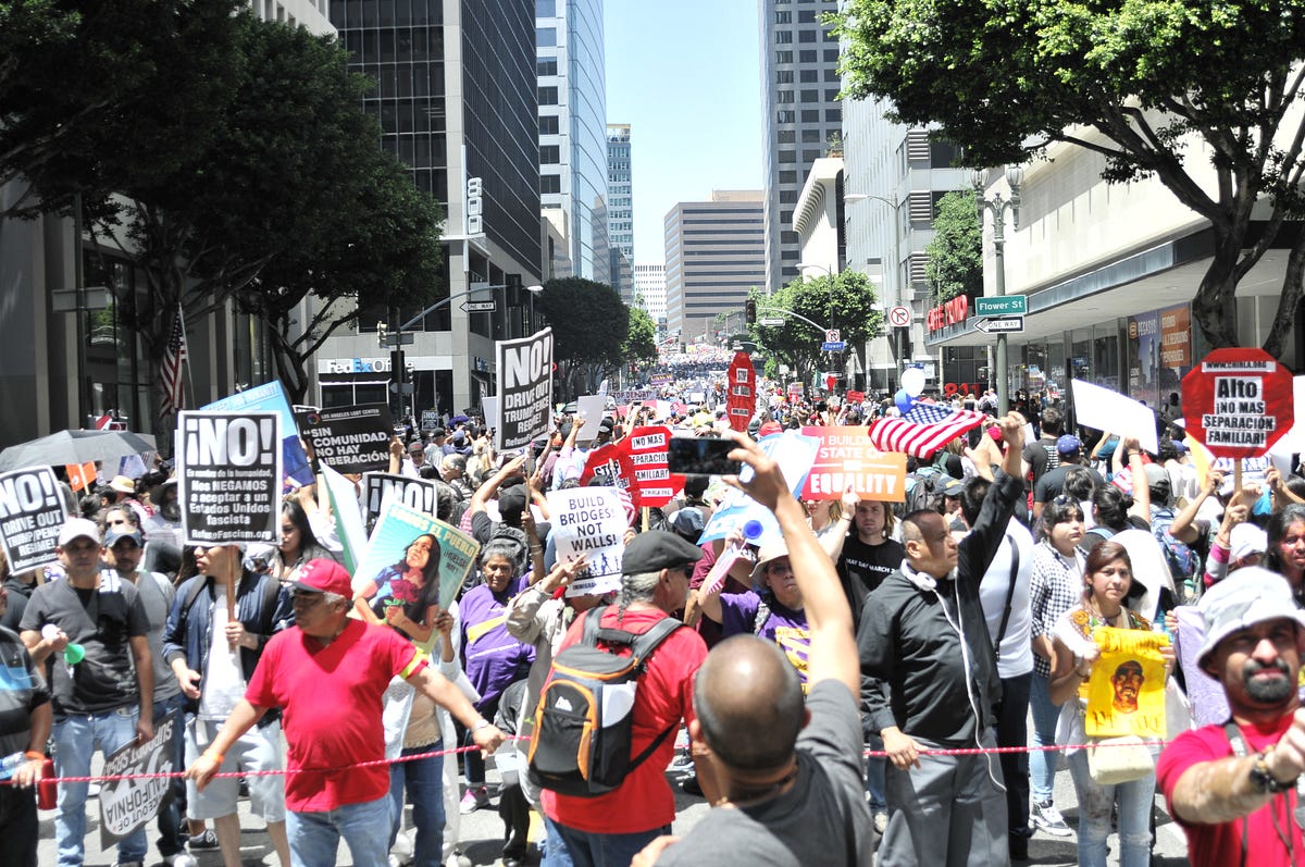 Tens of thousands of demonstrators gathered in Downtown Los Angeles to
