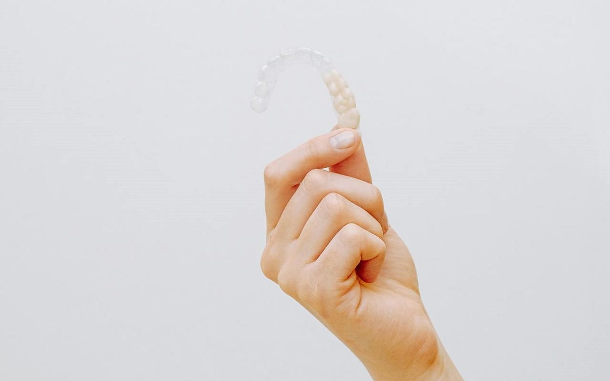 Unveiling a Brighter Smile: The Alluring Benefits of Clear Dental