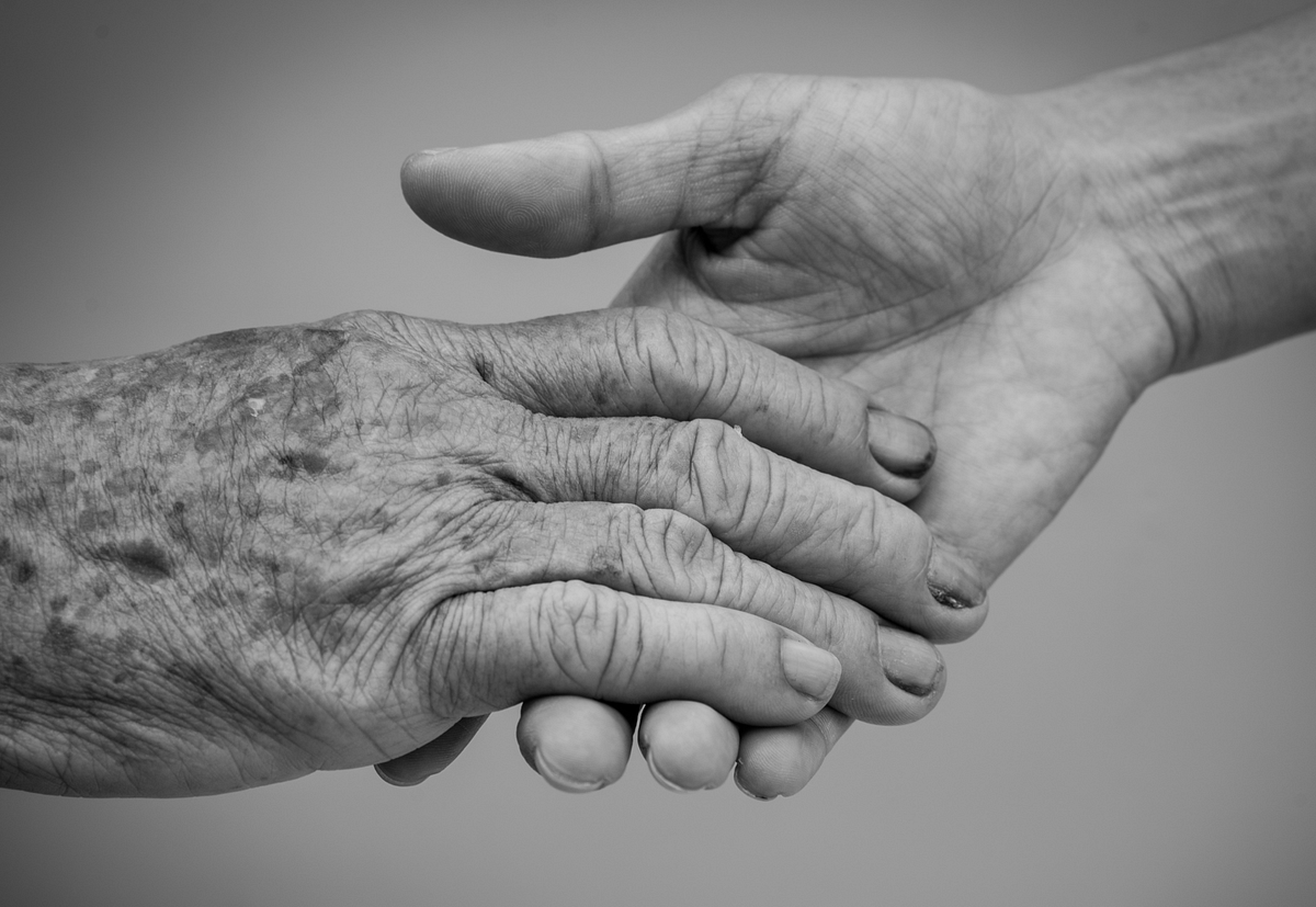Younger hands. Hold old'. Old hand and young hand.