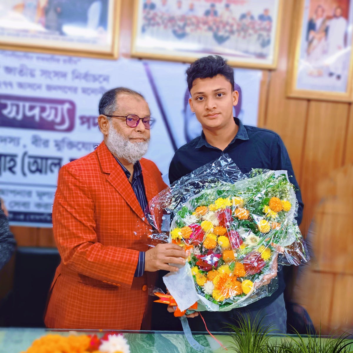 Md. Ismail Ahmed congratulated Abdullah Al-Mamun MP with flowers ...