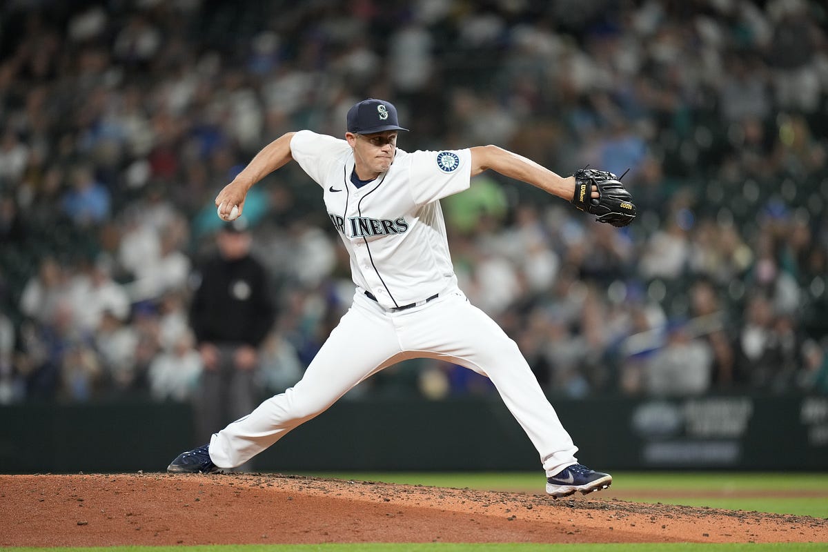 Seattle Mariners relief pitcher Paul Sewald stands between