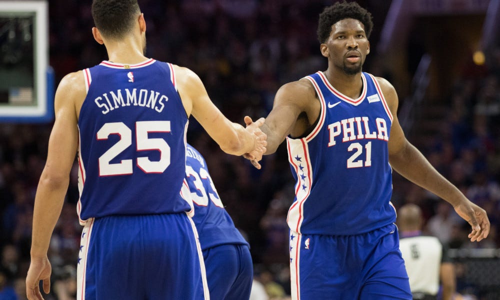 John Collins trolls 76ers' Joel Embiid with shirt of dunk