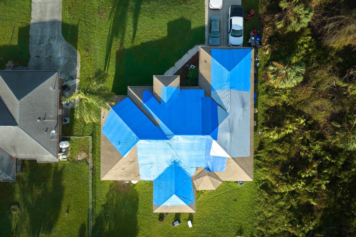 How Much Does It Cost To Tarp A Roof In 2024? Buffalo's Best Roofing
