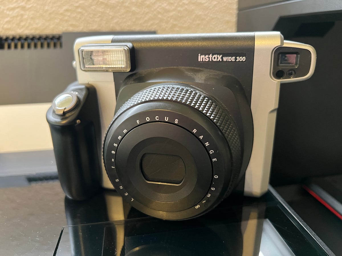 Instax Wide 300 Toffee Instant Camera. Polaroid camera white.