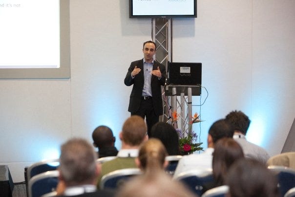 Nadeem Azam giving a presentation at a digital marketing conference at London’s Excel Centre