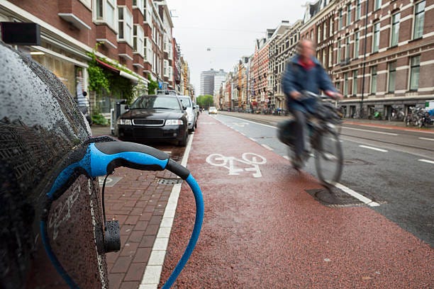 Journeys Divided: Bridging or deepening societal chasms through electric mobility?