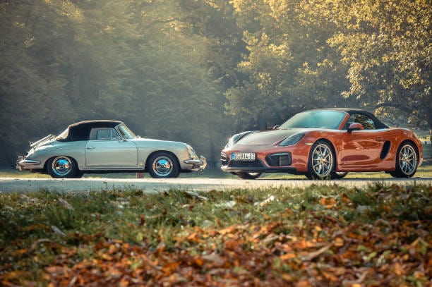 An old 60s Porsche next to a modern Porsche 911.