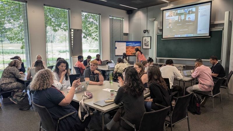 Image of workshop attendees working on activities in small groups.