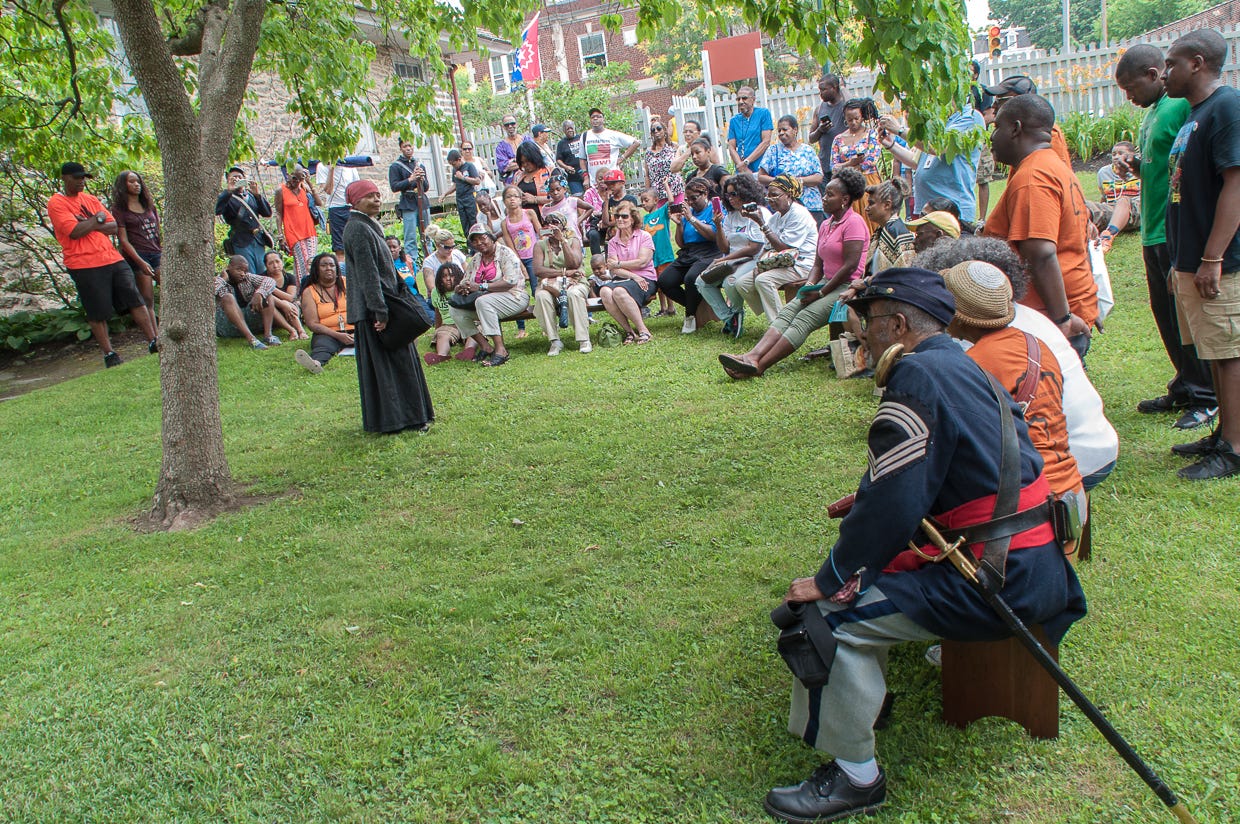 Millicent Sparks as Harriet Tubman, speaking to the audience gathered on the lawn of the Johnson House Historic Site. Photographed by Tieshka Smith at the 9th annual Philadelphia Juneteenth Festival in Germantown, June 20, 2015. This image is protected by copyright.