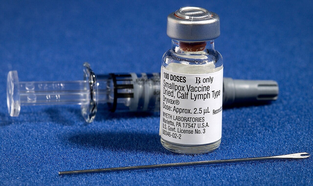 Components of a smallpox vaccination kit including the diluent, a vial of Dryvax® smallpox vaccine, and a bifurcated needle. Photo Credit: James Gathany, U.S. Centers for Disease Control. Public domain