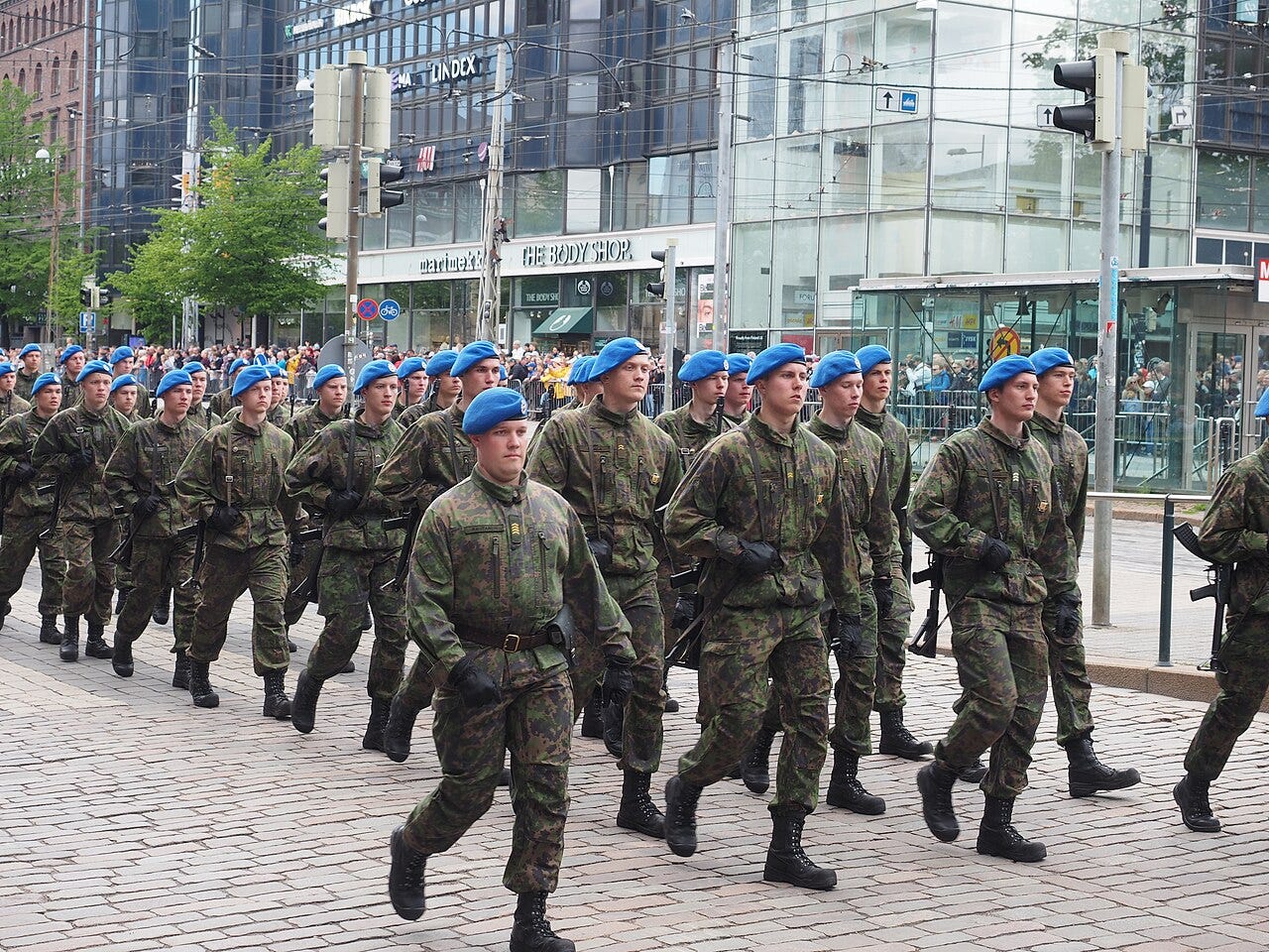 Soldiers with blue berets marching at Flag Day of Finnish Defence Forces 2022