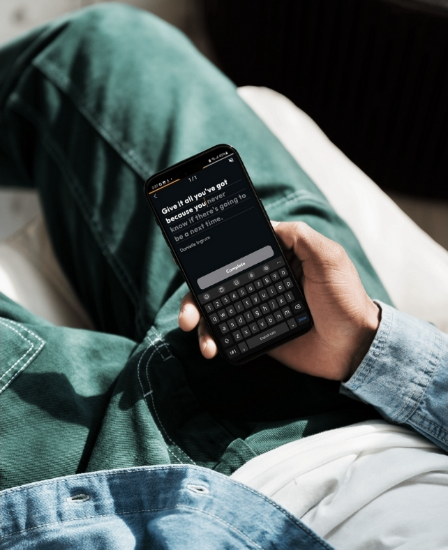 User completing a motivational typing mission on their smartphone, showcasing how interactive alarm features can kickstart the day with inspiration. Keywords: alarm clock mission, best alarm app, daily reminders, free alarm clock app.