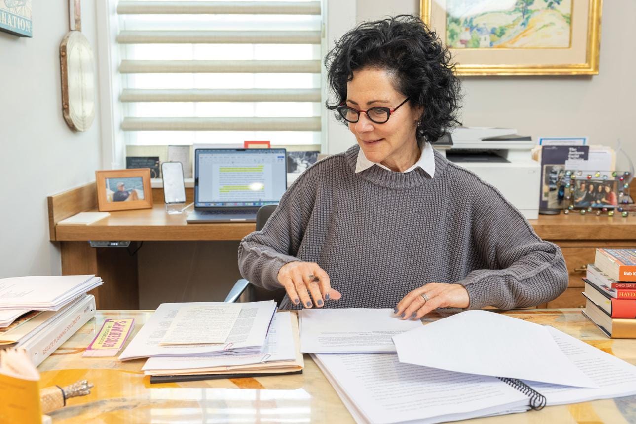 Author reviewing a manuscript before submitting it to a publisher.How