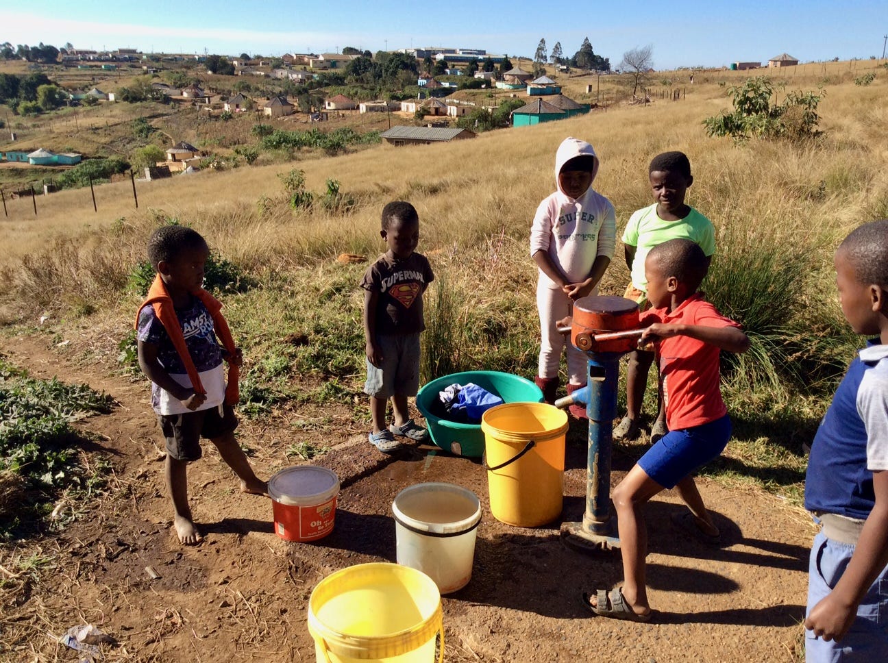Ufafa Valley children draw water near the Woza Moya project headquarters.