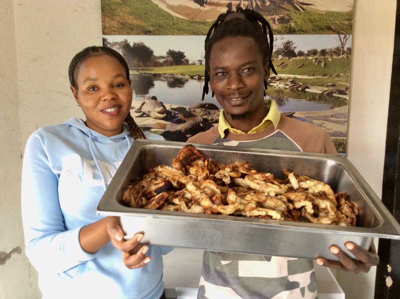 Croc man Raphael Tsaurayi with assistant Zanele Nzuza, bearing choice croc bites. Photo: Wanda Hennig
